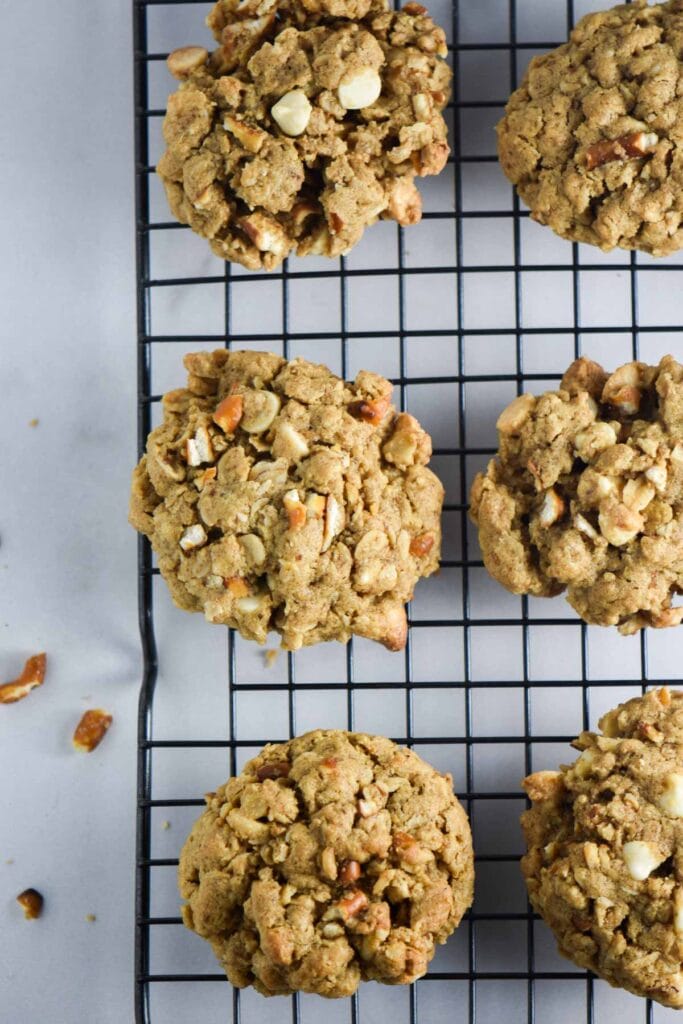 White chocolate pretzel cookies on a cookie cooling rack.