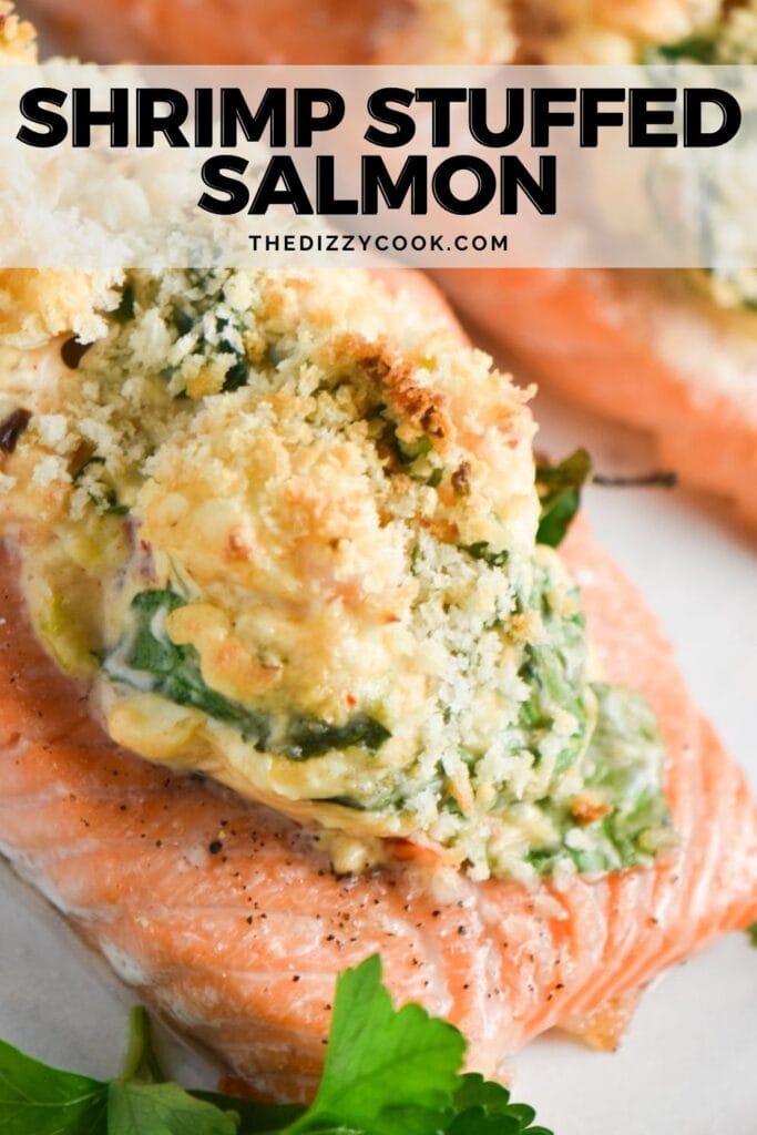 Salmon fillets stuffed with creamy shrimp and spinach on a white plate.