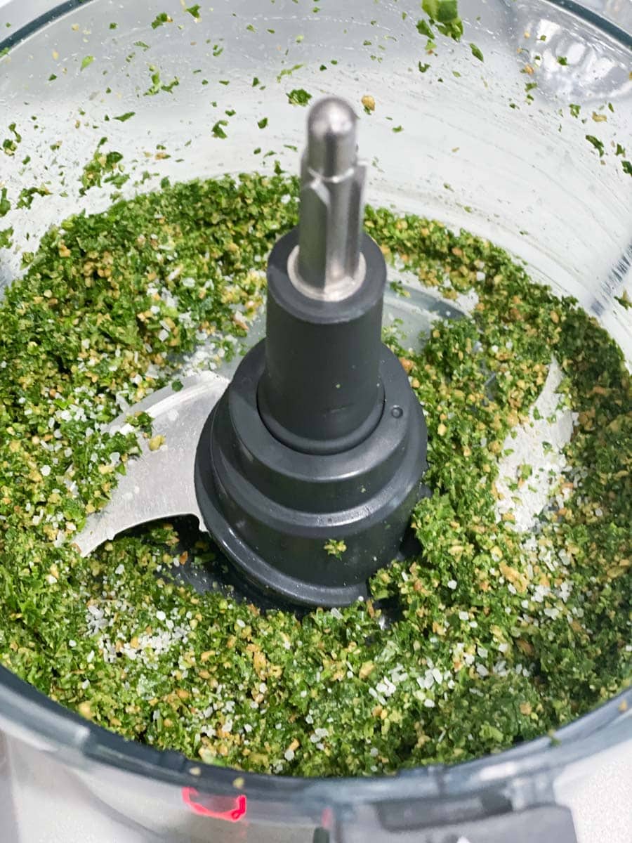 Basil and sunflower seeds ground up in a food processor. 