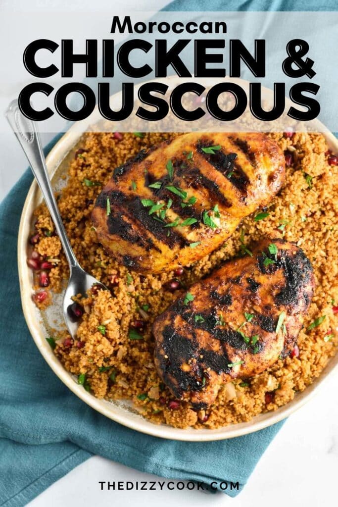 Chicken and couscous on a plate with a spoon.