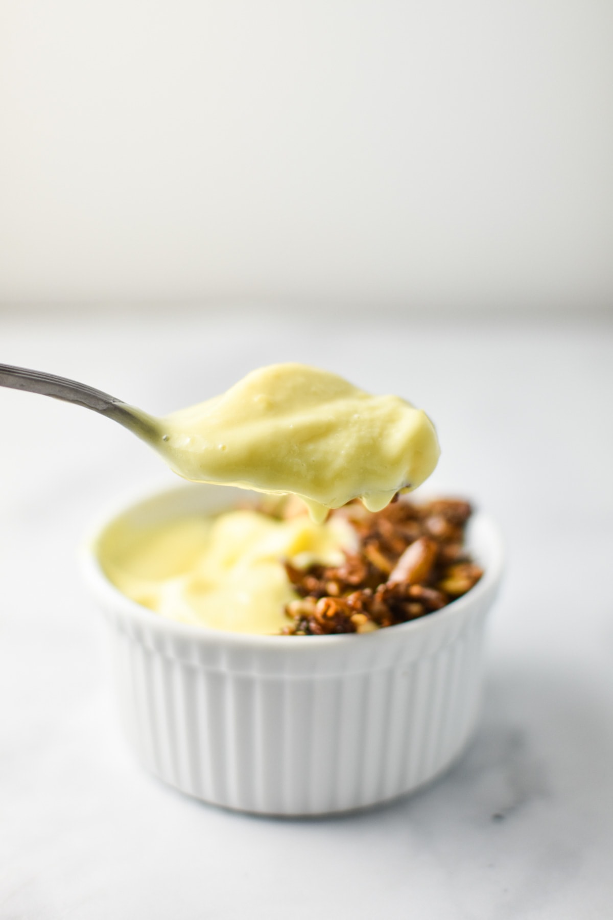 A spoonful of creamy mango lassi.