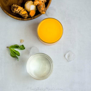 A mango smoothie on a table.