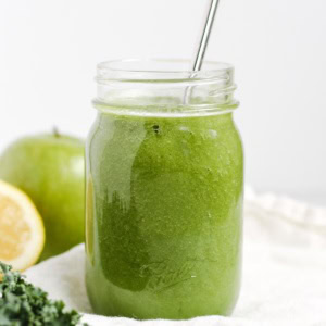 A green smoothie on a white napkin.