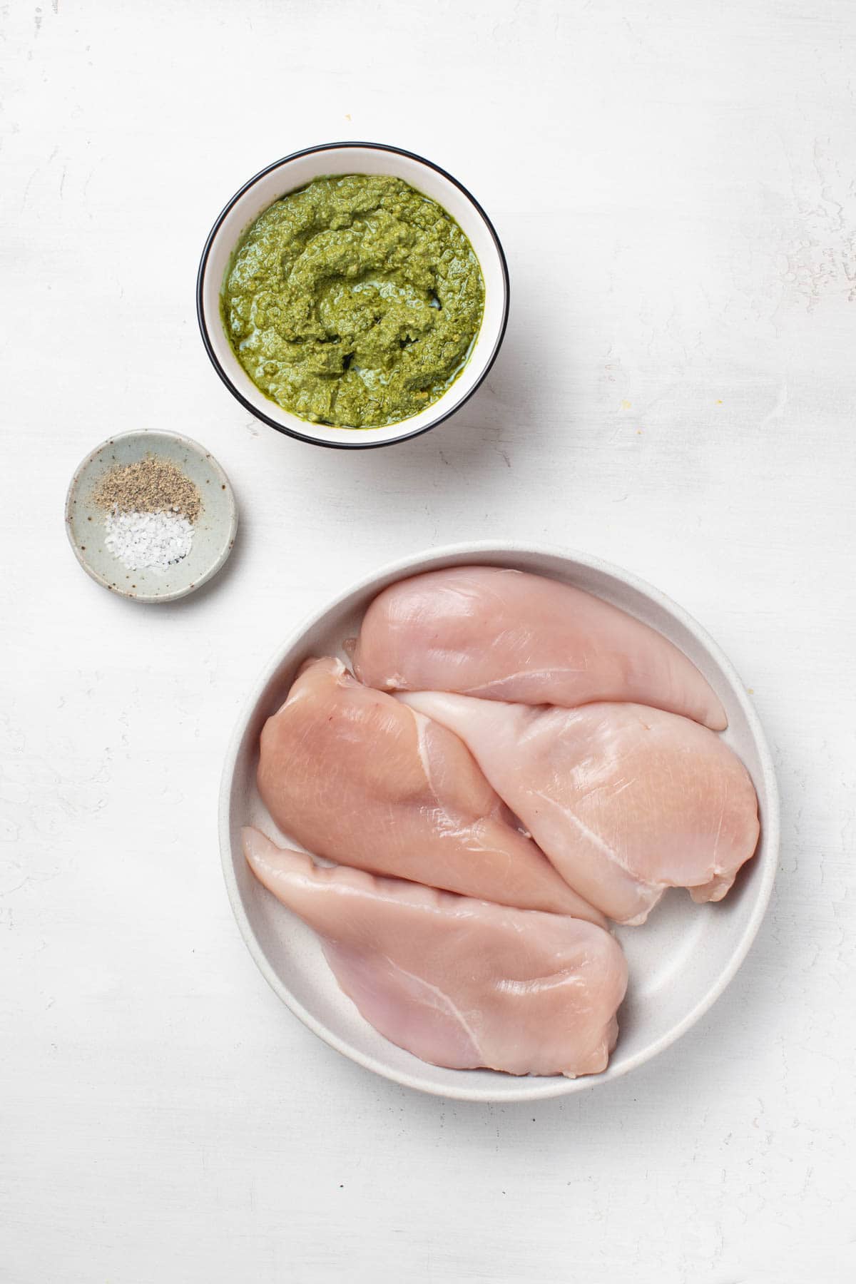 Ingredients for slow cooker pesto chicken.