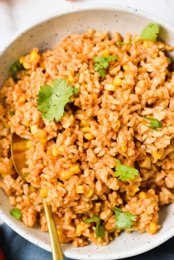 A spoon dipping into Tex Mex rice.