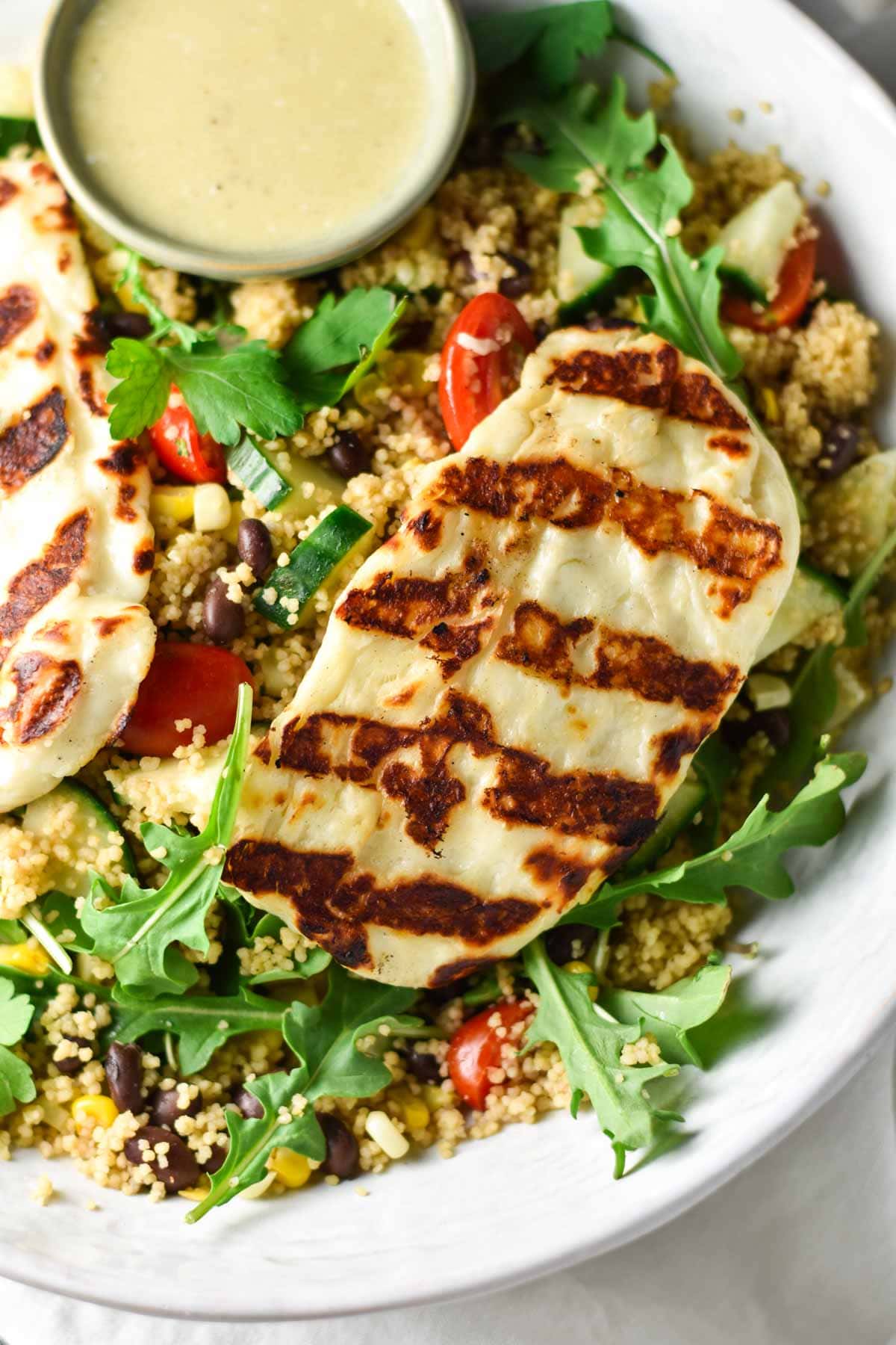 Grilled halloumi on top of couscous.