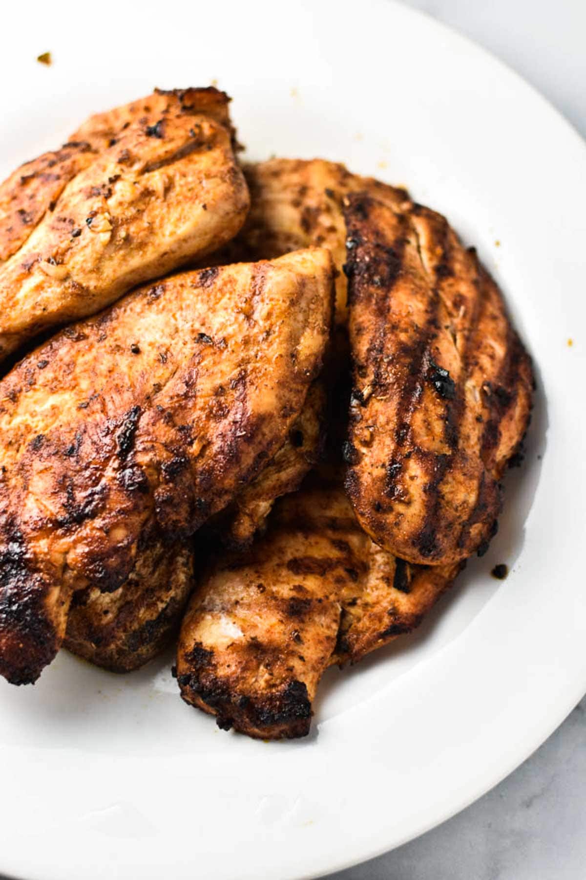 Grilled chicken on a white plate