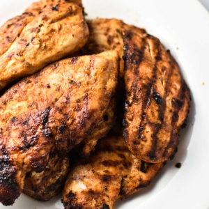Mexican grilled chicken on a plate.