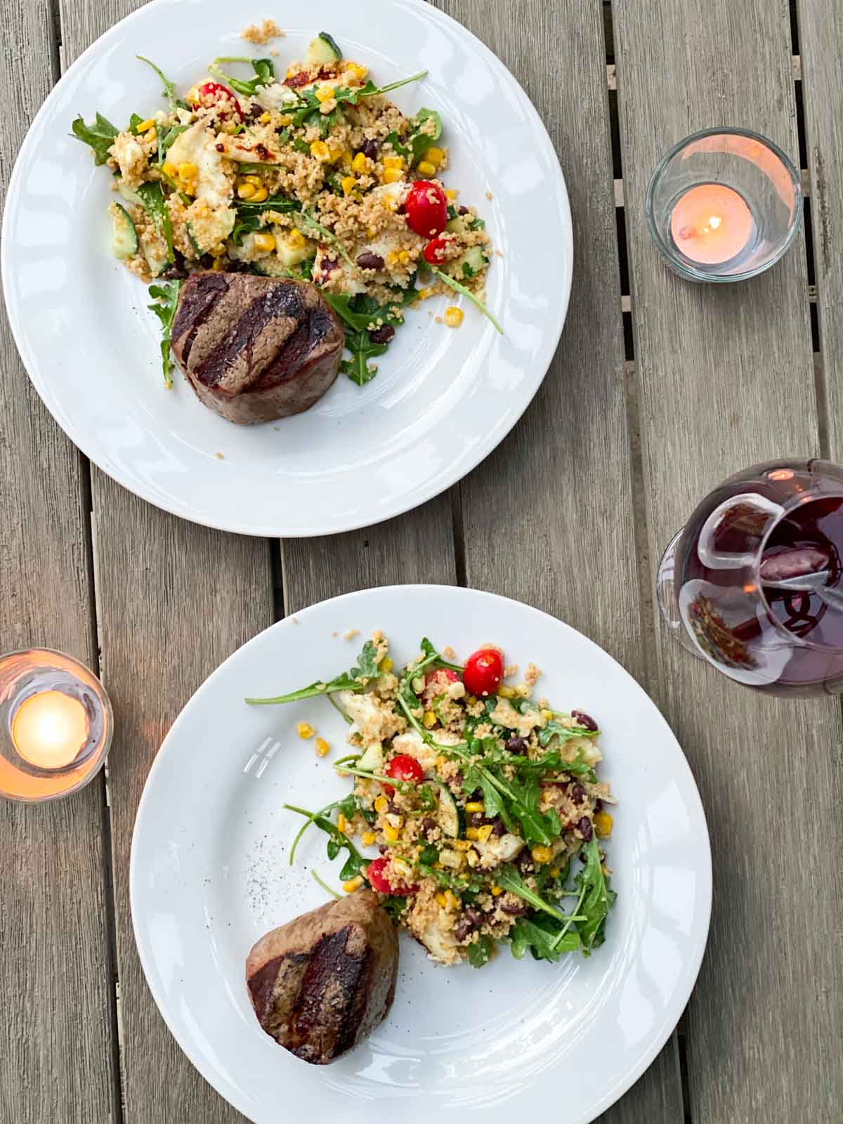 An alfresco dinner with steak and salad.