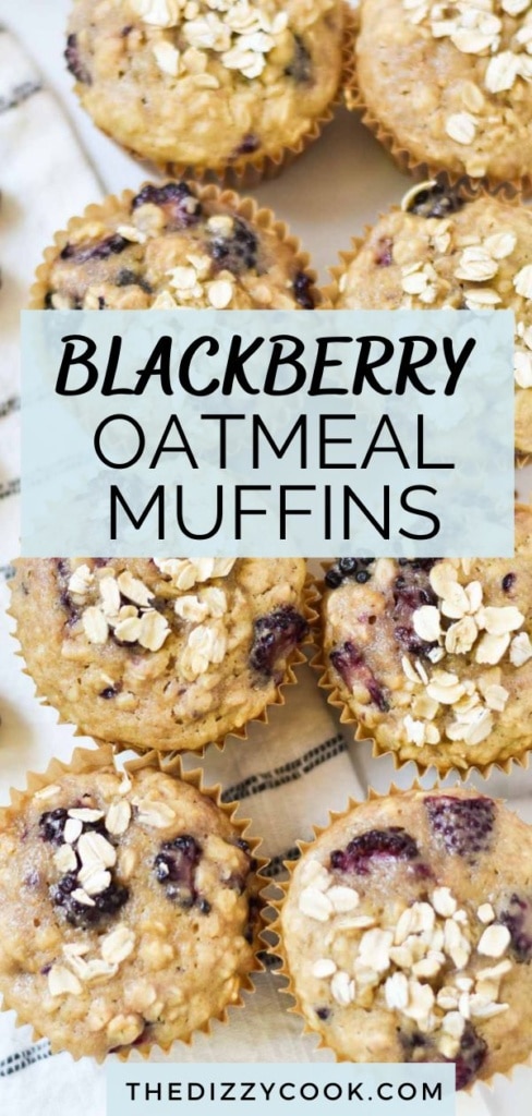 Blackberry oatmeal muffins stacked on a towel.