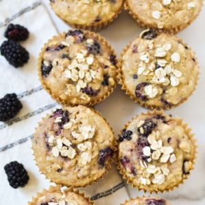 Blackberry oatmeal muffins on a towel.