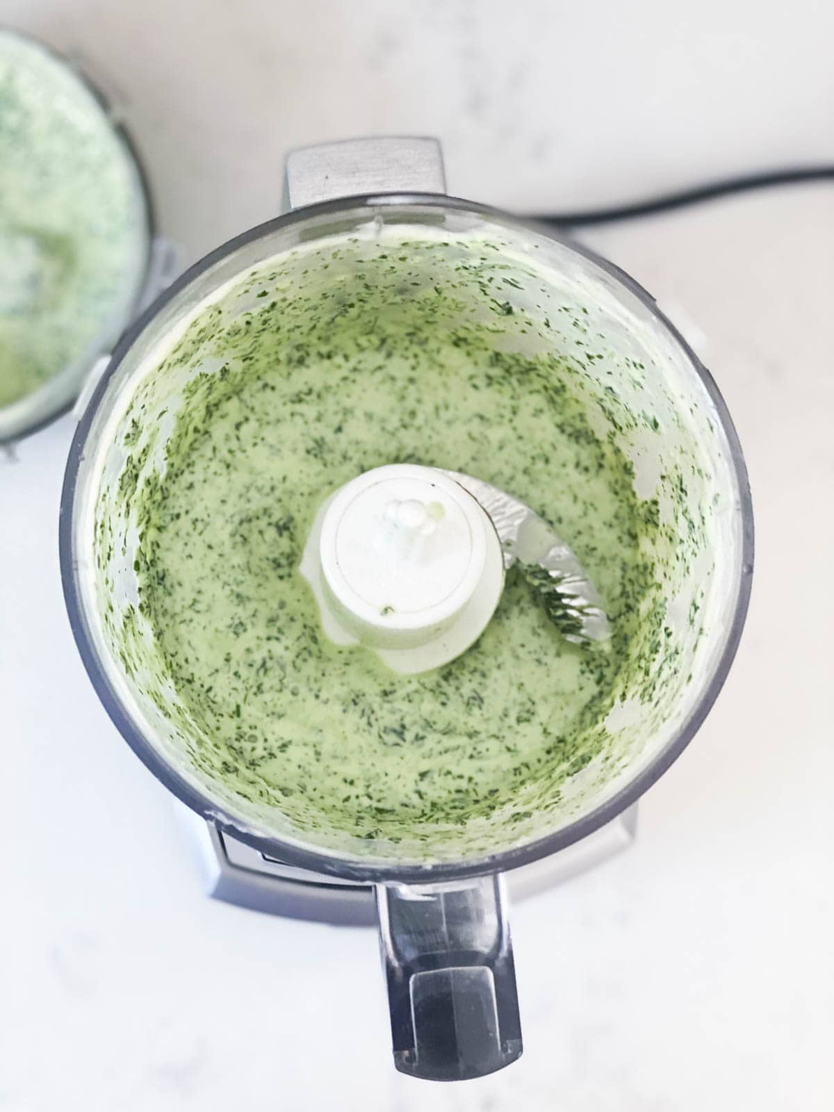 Blending a creamy cilantro sauce for tacos.