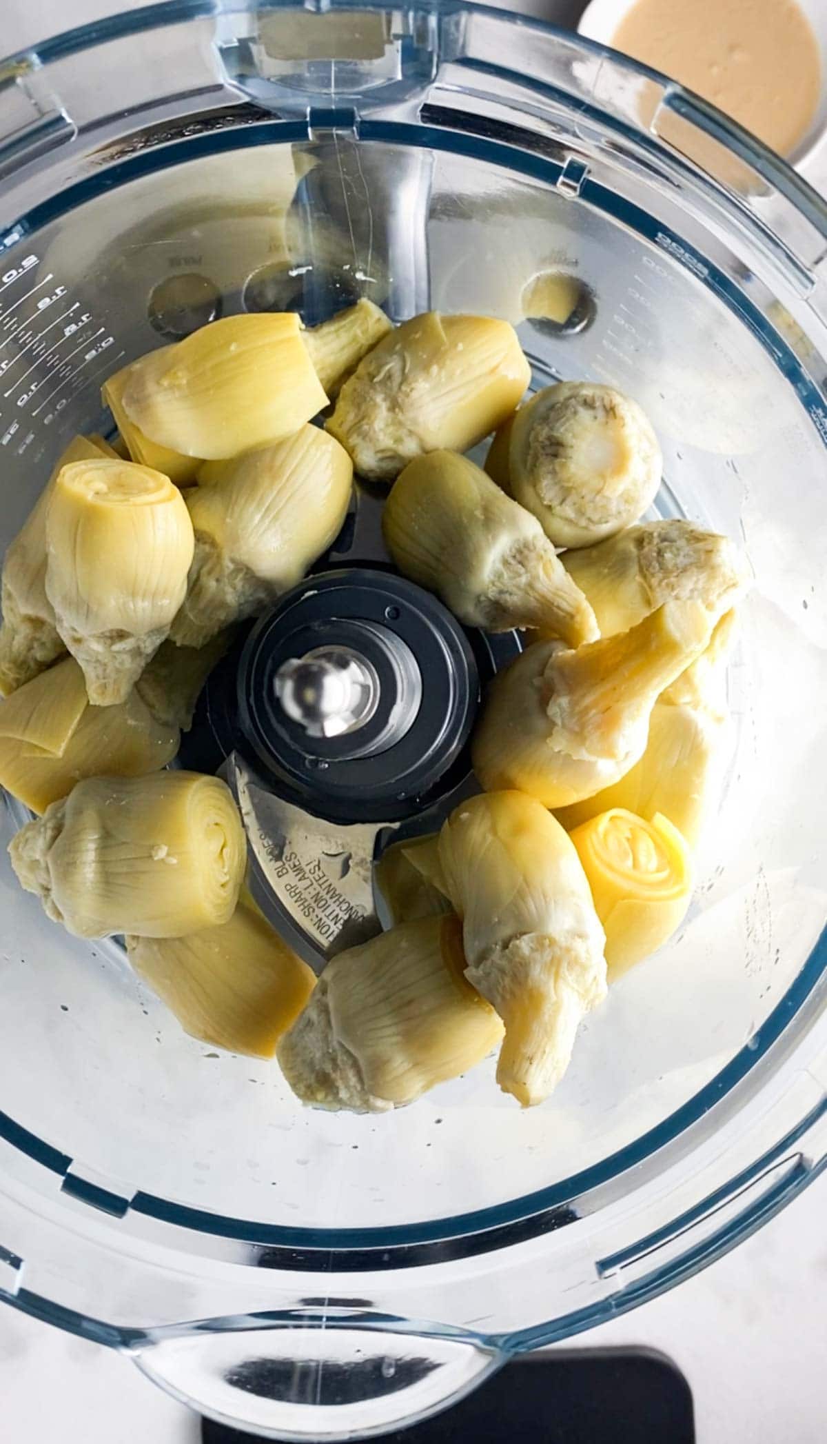 Artichoke hearts in a food processor.