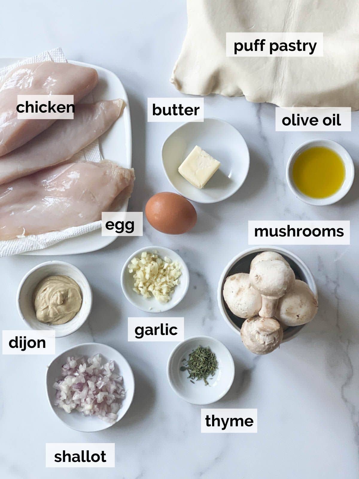 Ingredients for chicken wellington on a table. 