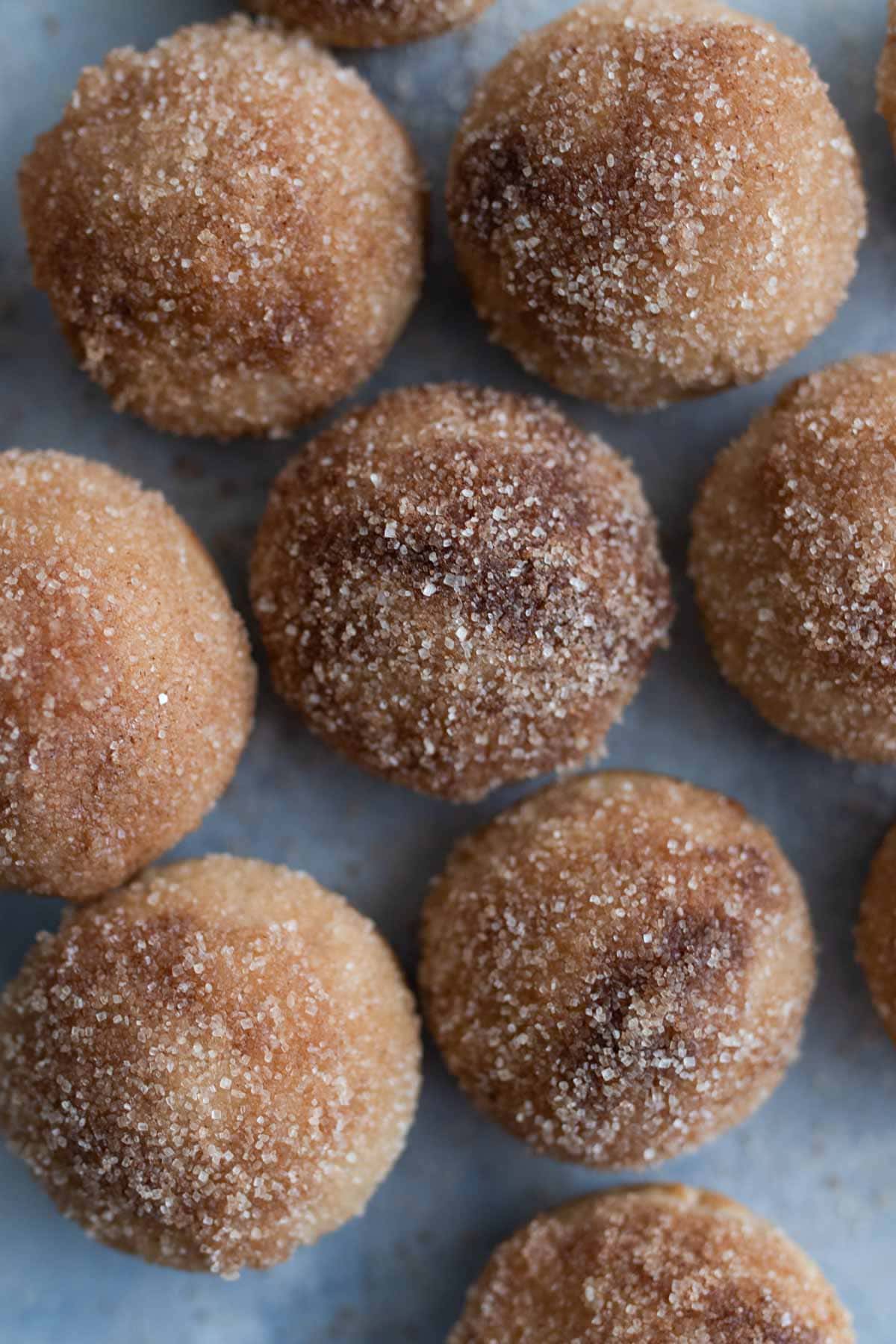Apple cider donut holes on a tray. 