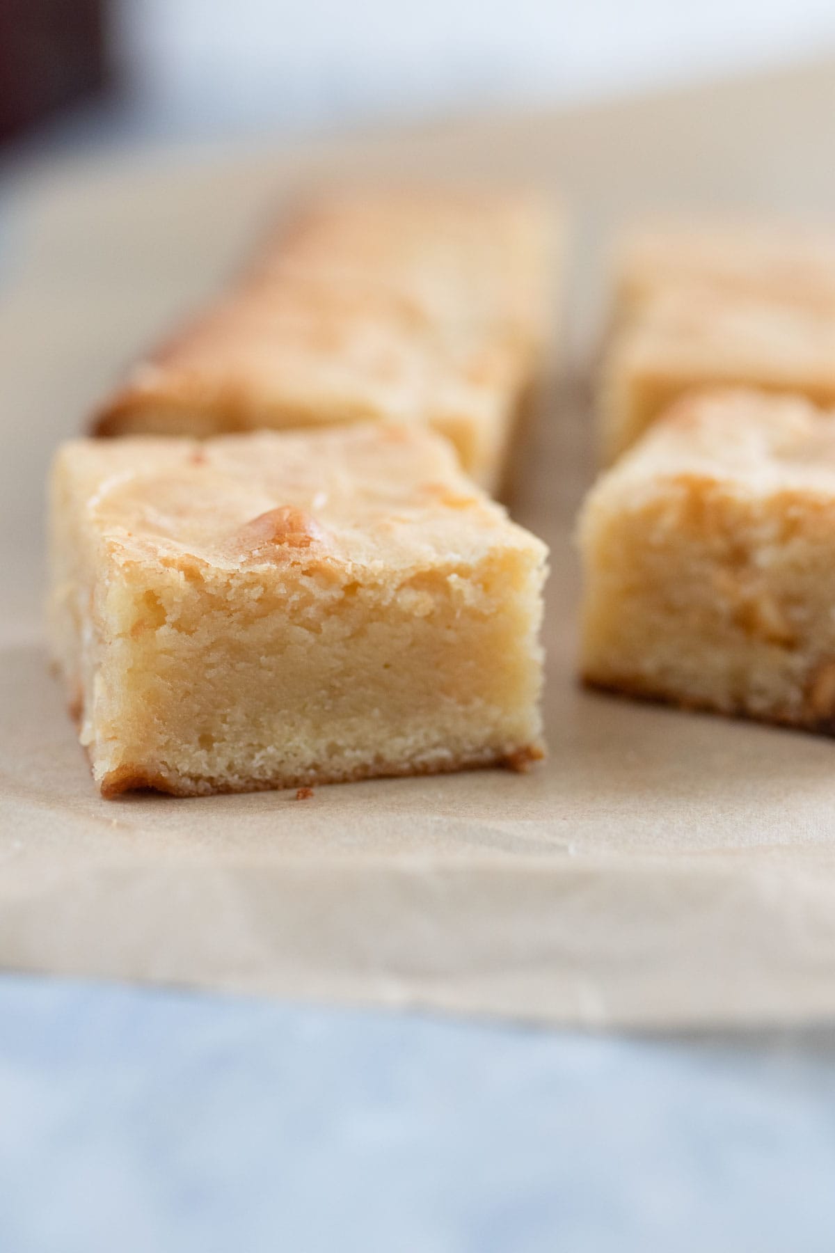 A sliced white chocolate blondie to show the gooey texture.