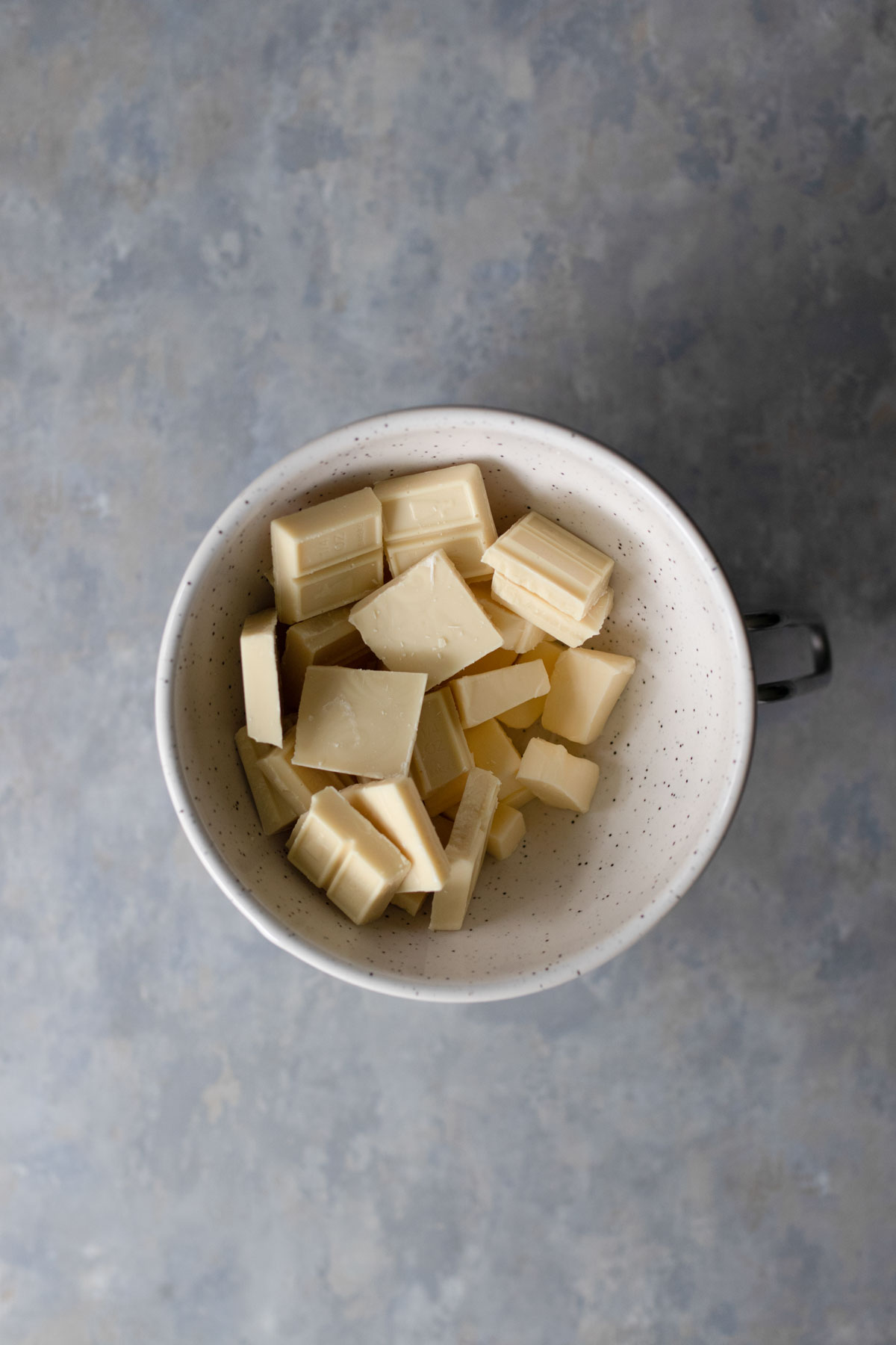 White chocolate bar pieces in a bowl.