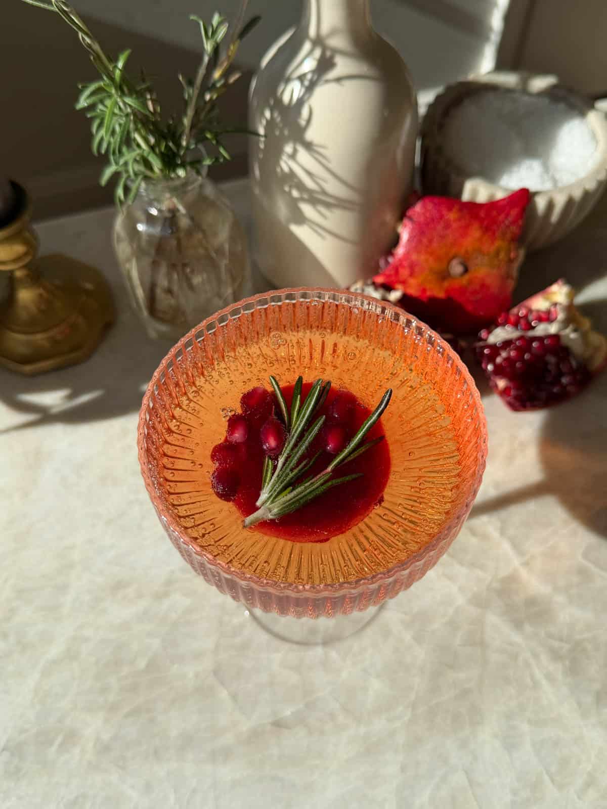 A pomegranate ice cube in ginger ale.