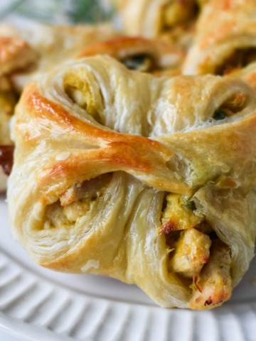 Chicken in puff pastry on a plate.