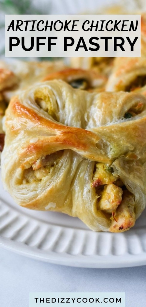 Chicken stuffed in puff pastry on a plate.