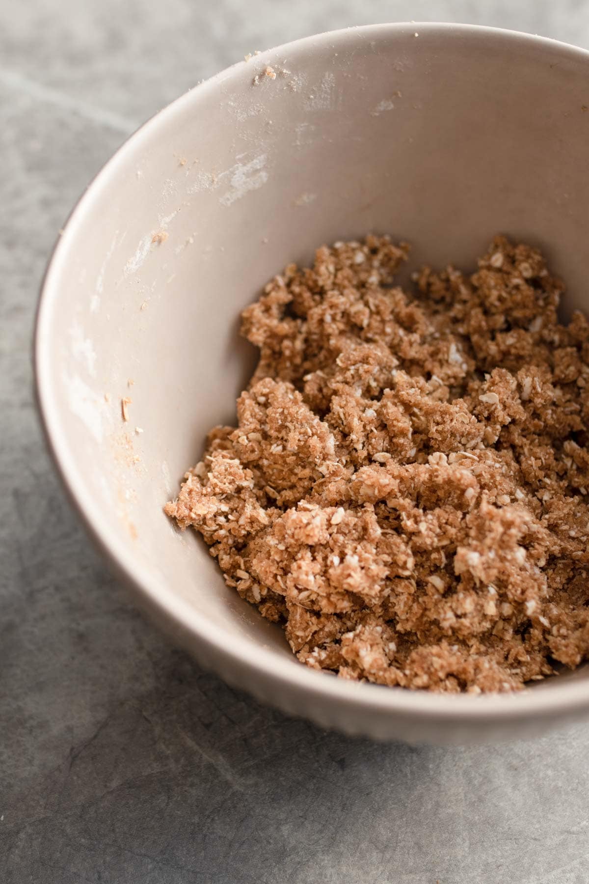Cinnamon, oats and sugar combined in a bowl to make a crumble. 