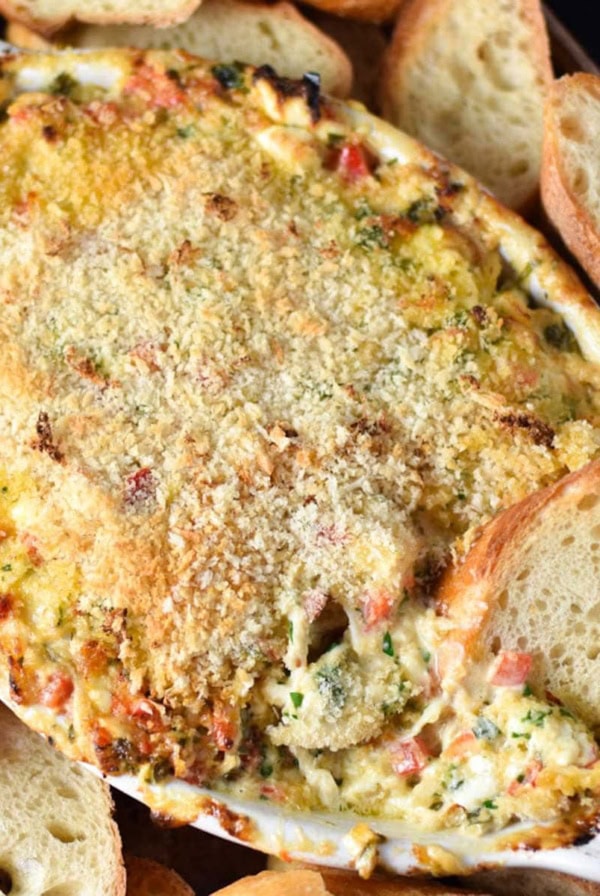 Cream cheese crab dip in an au gratin dish.