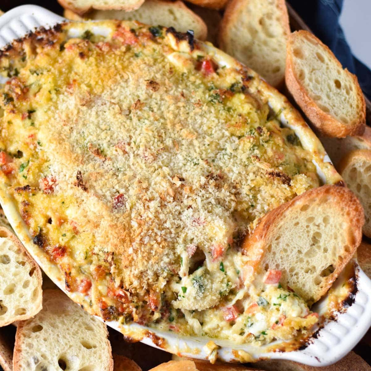 Cream cheese crab dip in an au gratin dish.