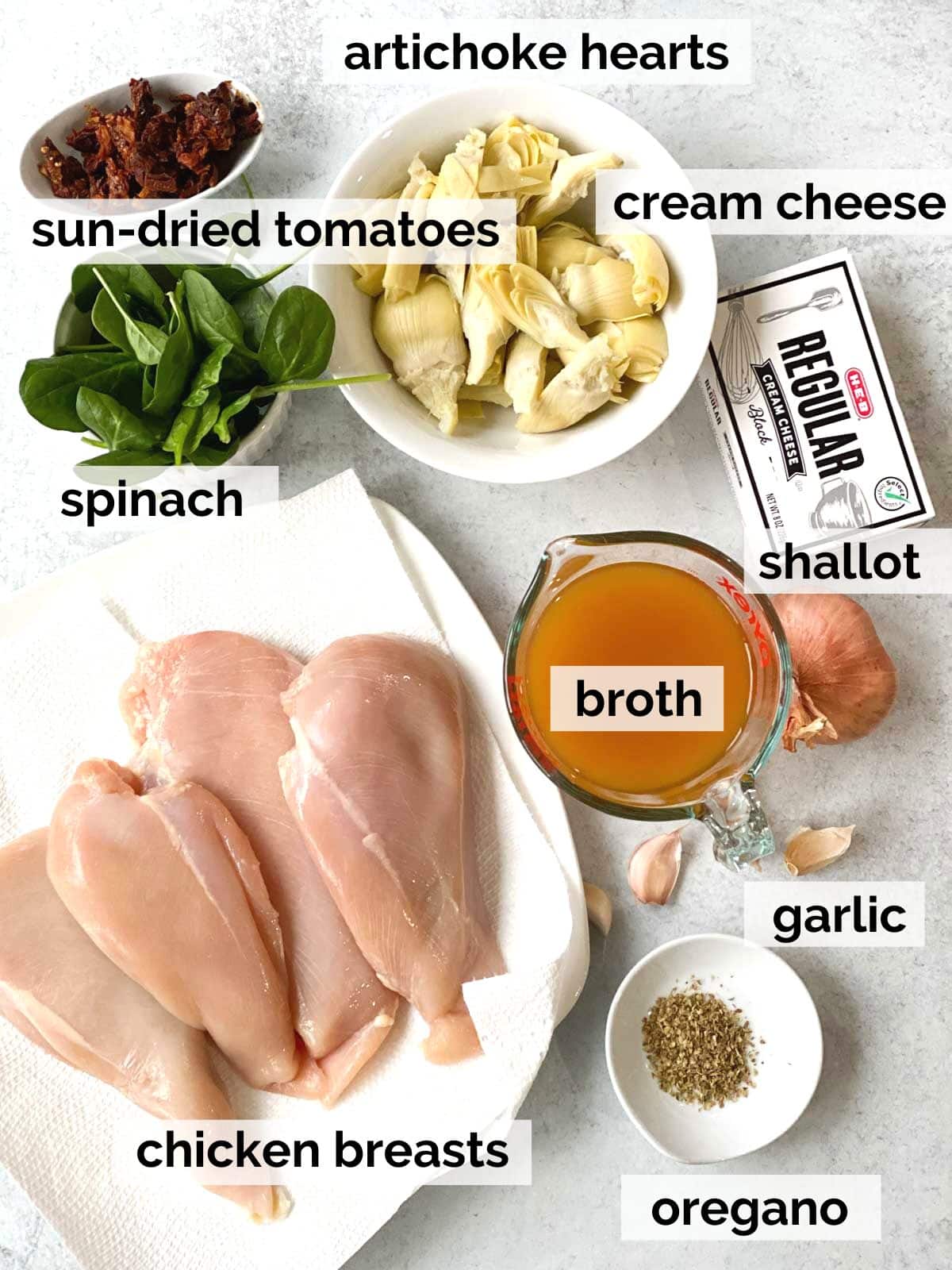Ingredients for Tuscan chicken on a table.