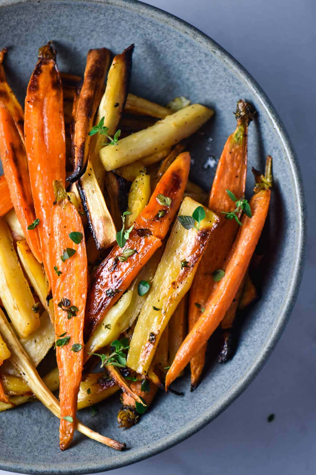 A bowl of carrots and parsnips.
