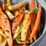 Roasted carrots and parsnips in a bowl.