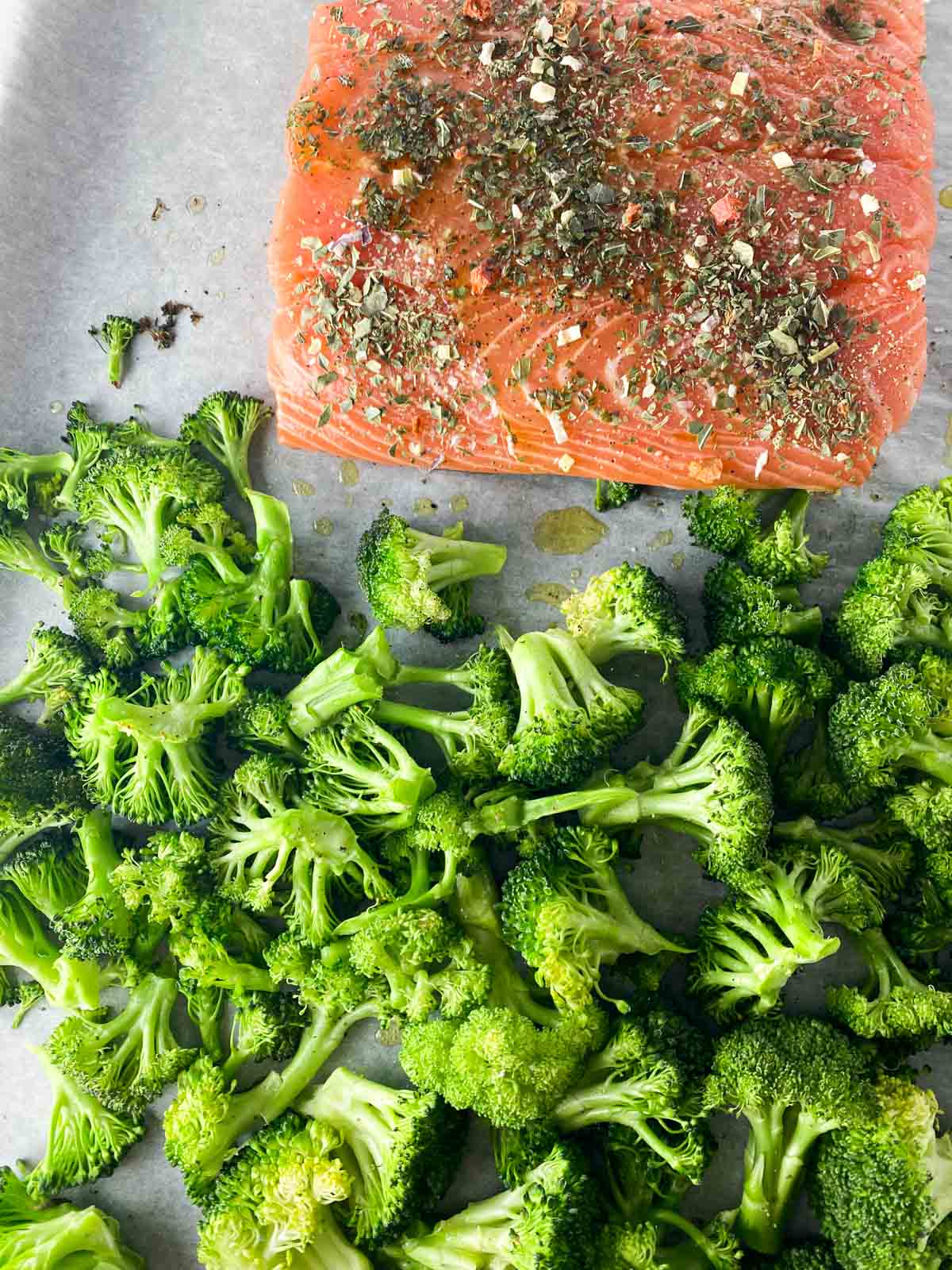 Salmon and broccoli on a sheet pan.