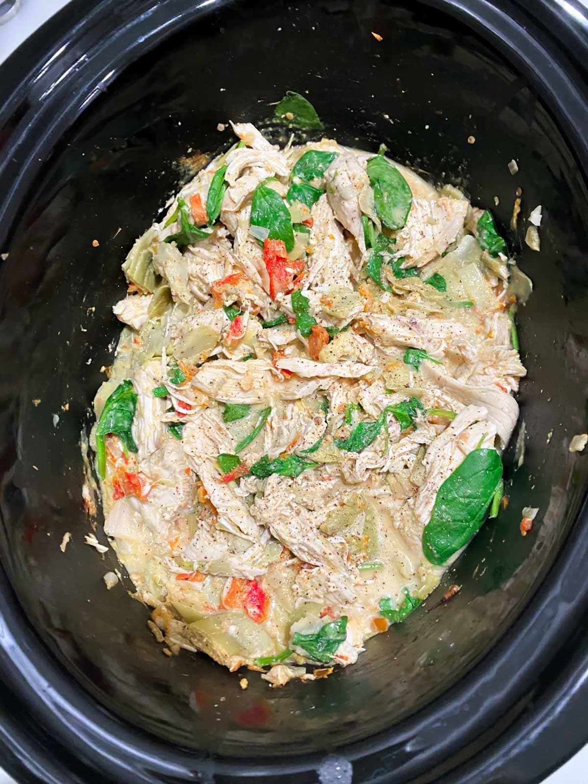 Shredded chicken and spinach in a Tuscan cream sauce.