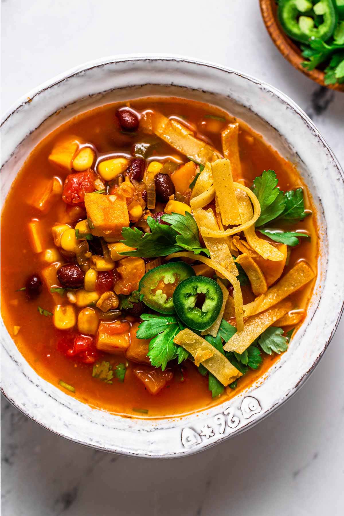 Vegetable soup in a white bowl. 