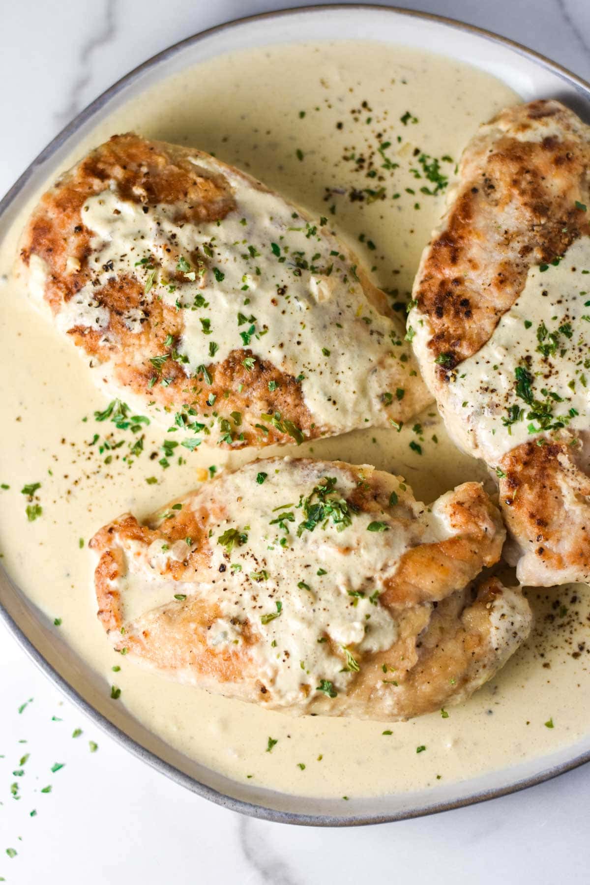 Creamy boursin chicken on a plate.