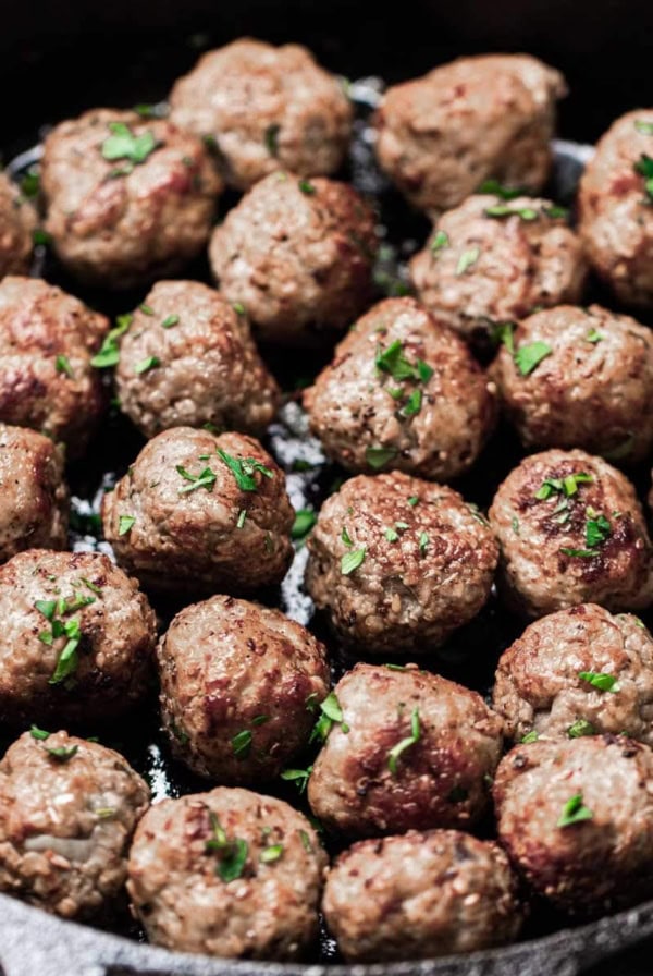 Meatballs in a cast iron pan.