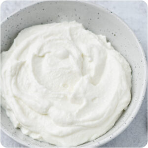 A bowl of fluffy, white whipped cottage cheese.