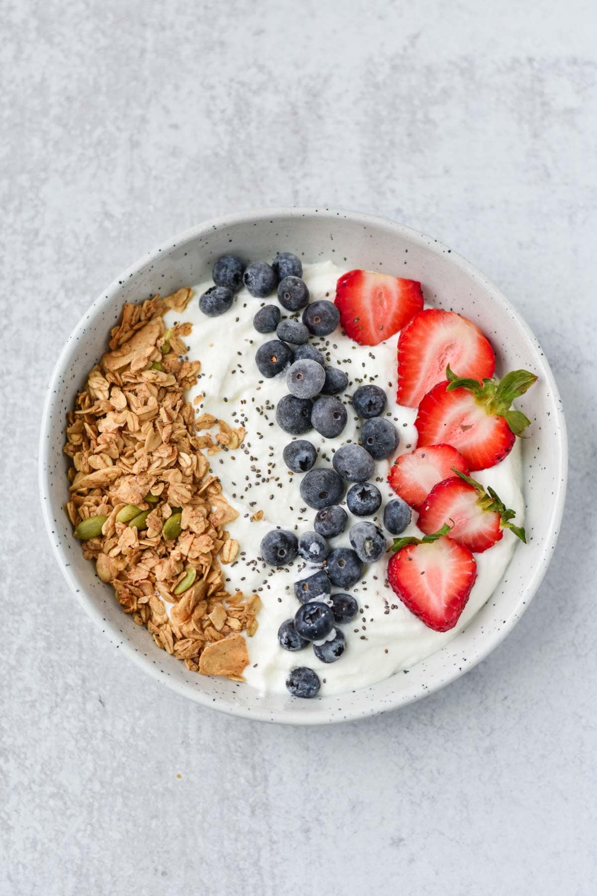Cottage cheese in a bowl with berries.