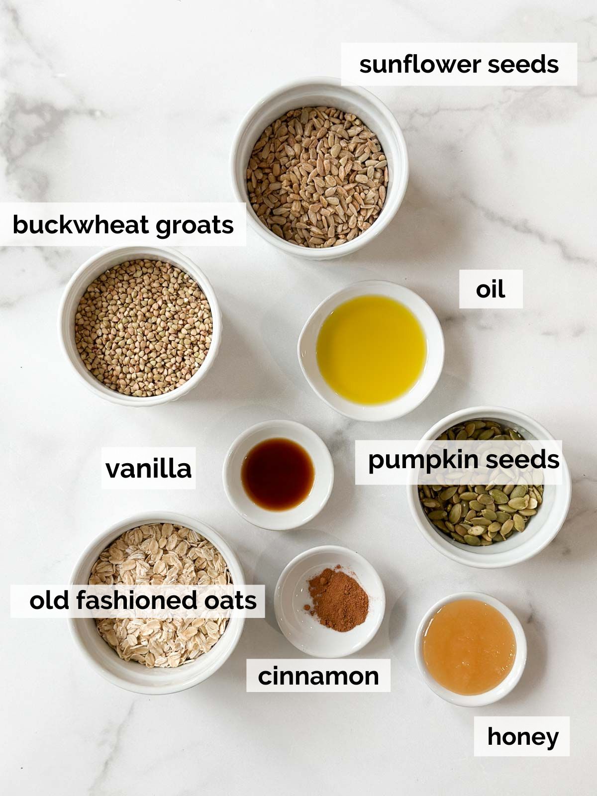 Ingredients for buckwheat granola on a white background.