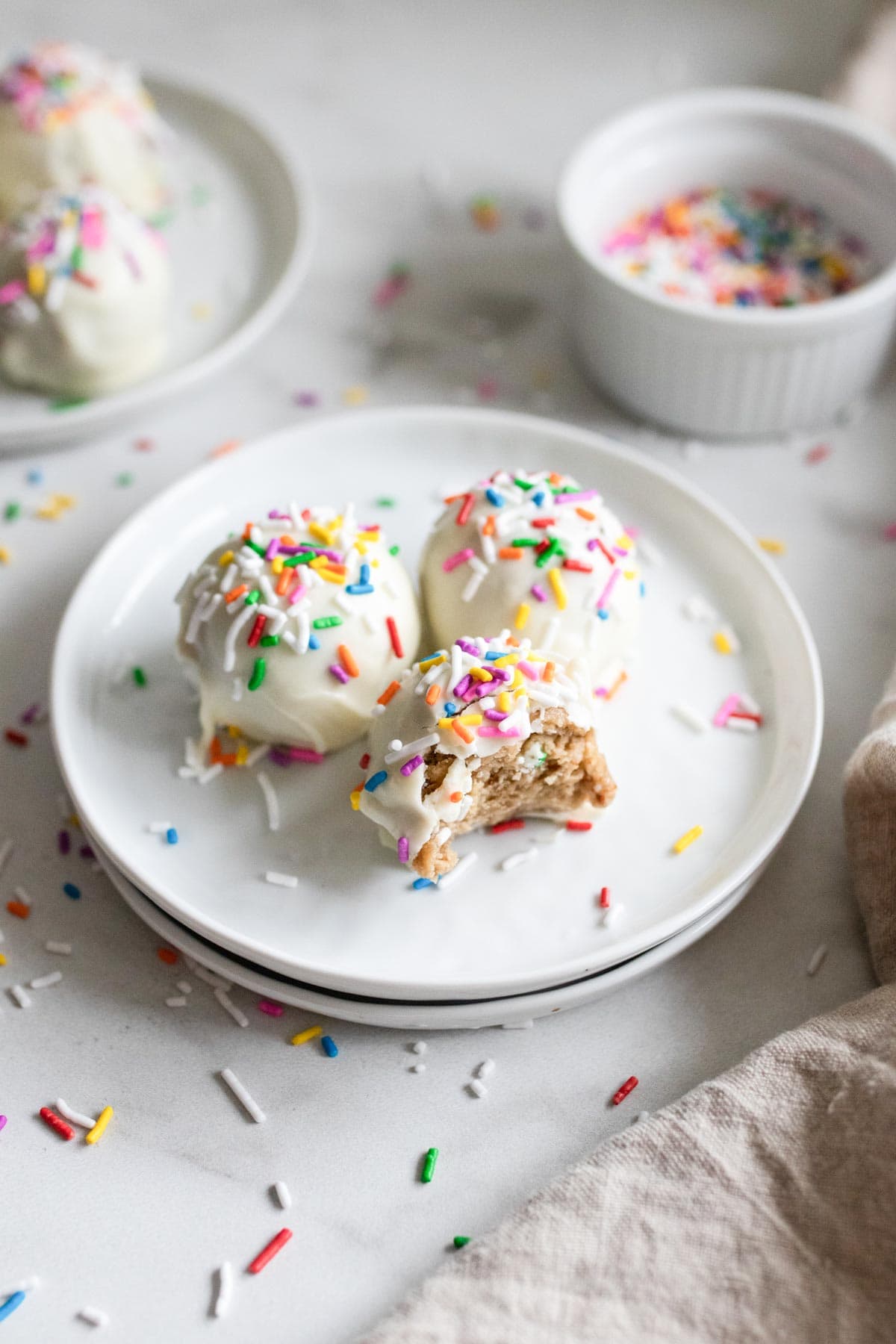 A bite out of a cake ball that shows the inside. 