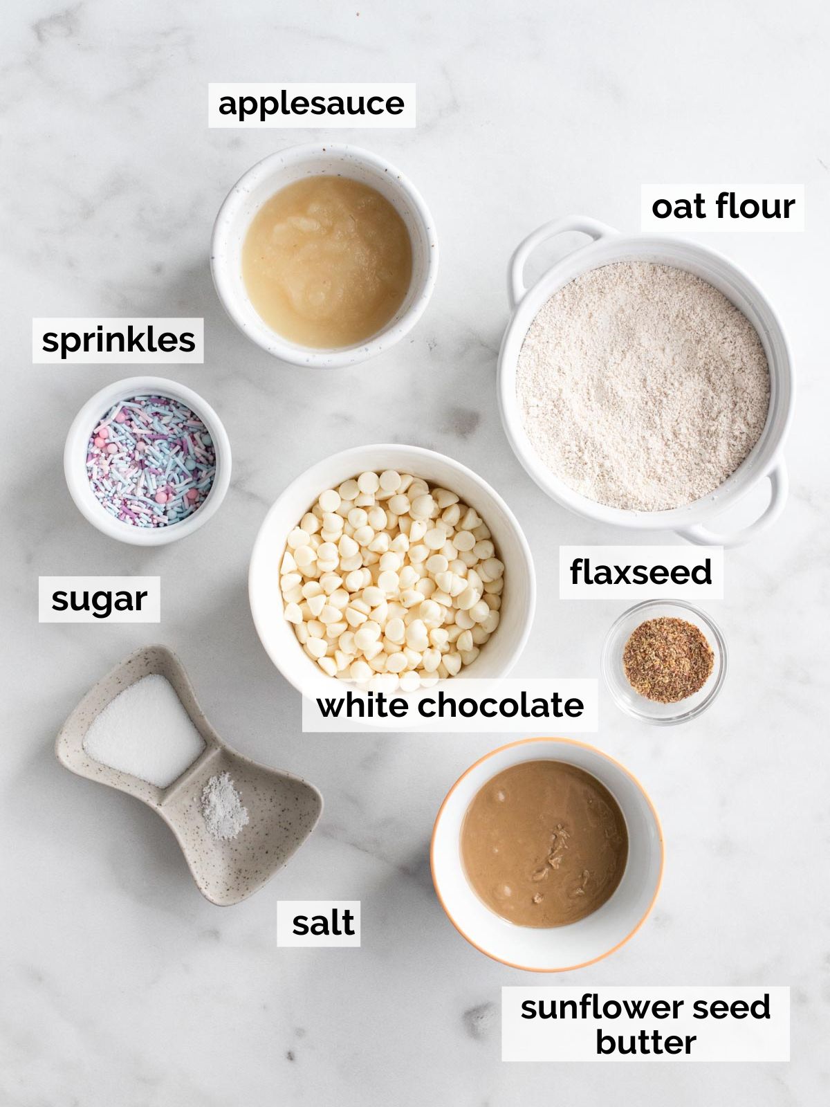 Cake pop ingredients on a marble table.