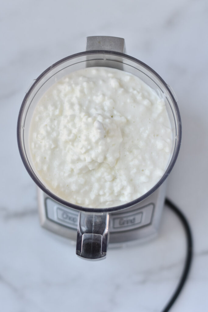 Cottage cheese in a food processor before whipping. 