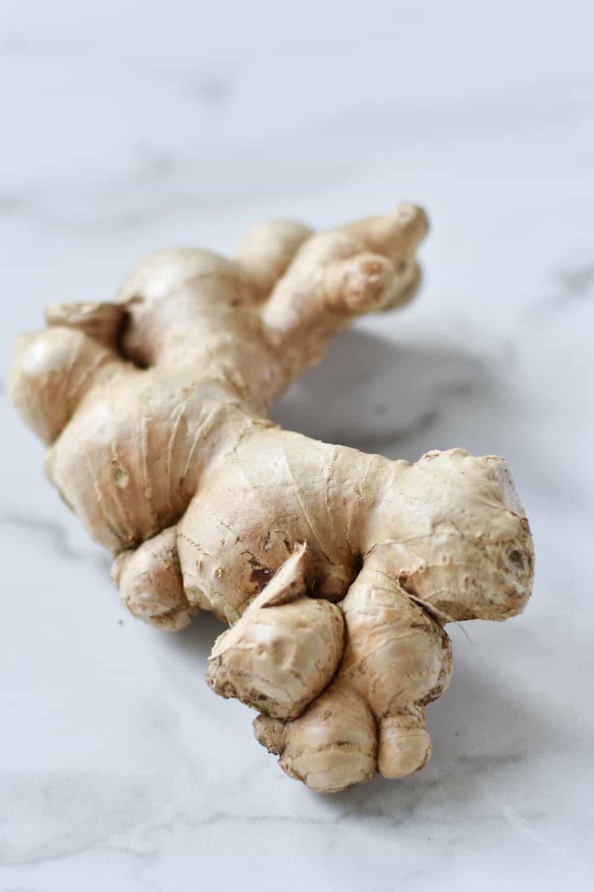Ginger root on a marble table.