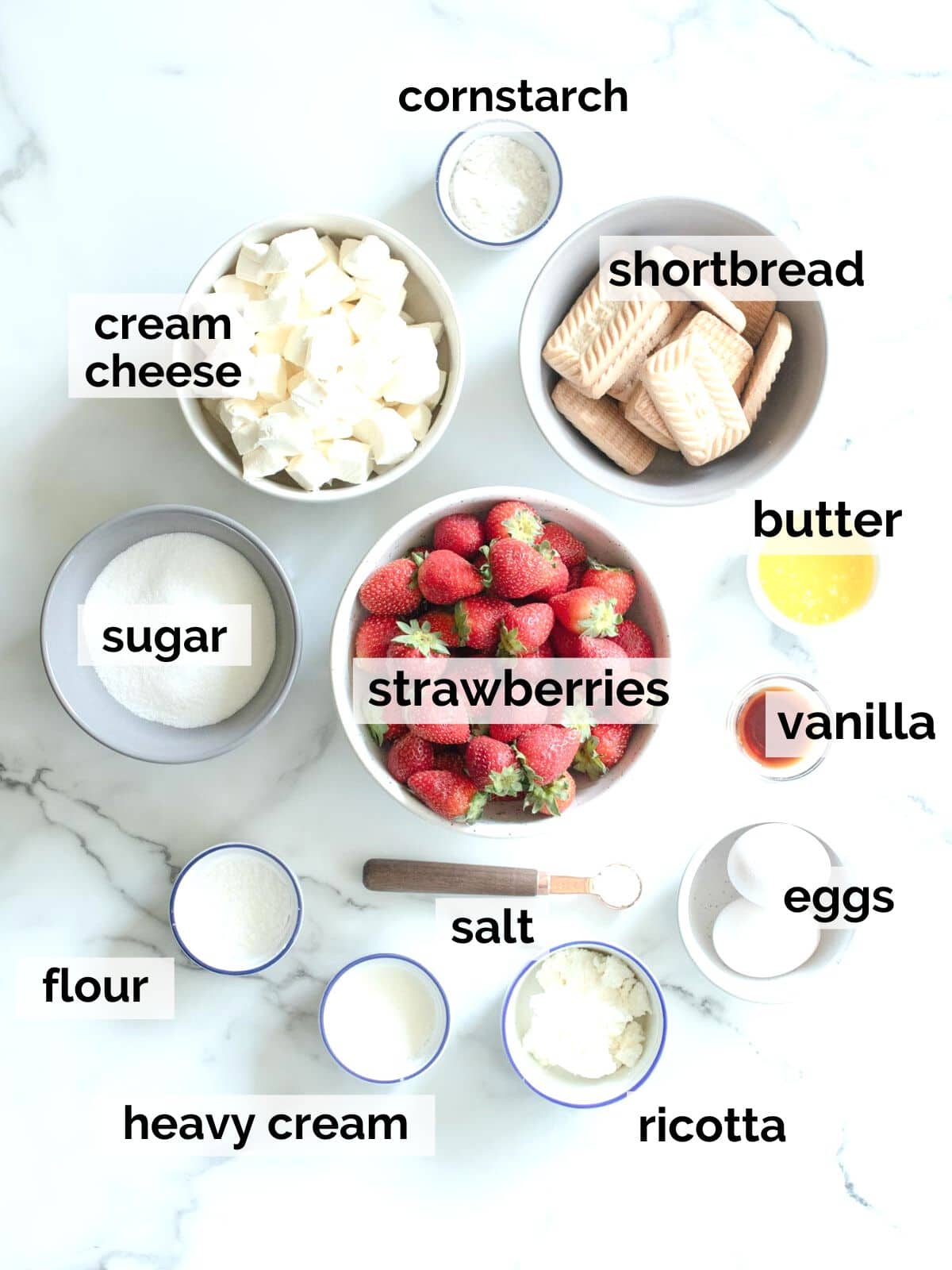 Ingredients for cheesecake bars with strawberries.