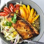A fork dipping into a fish taco bowl.