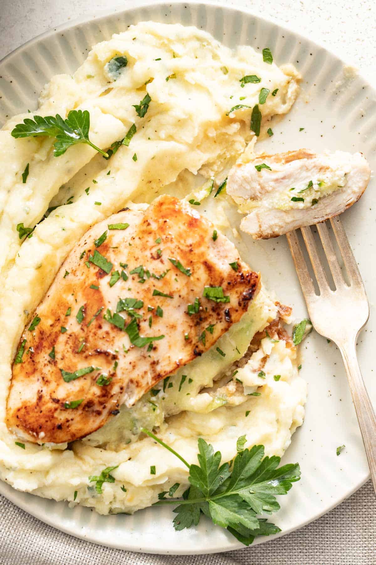 A sliced chicken stuffed with ricotta cheese and zucchini.