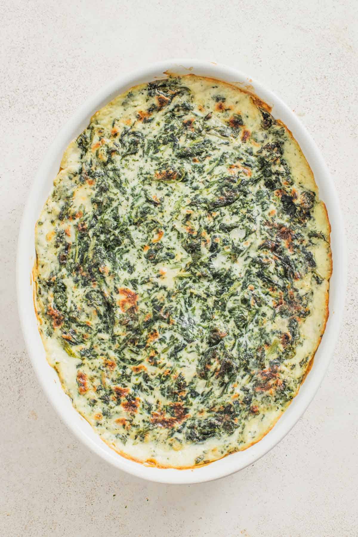 A baked spinach casserole dish.