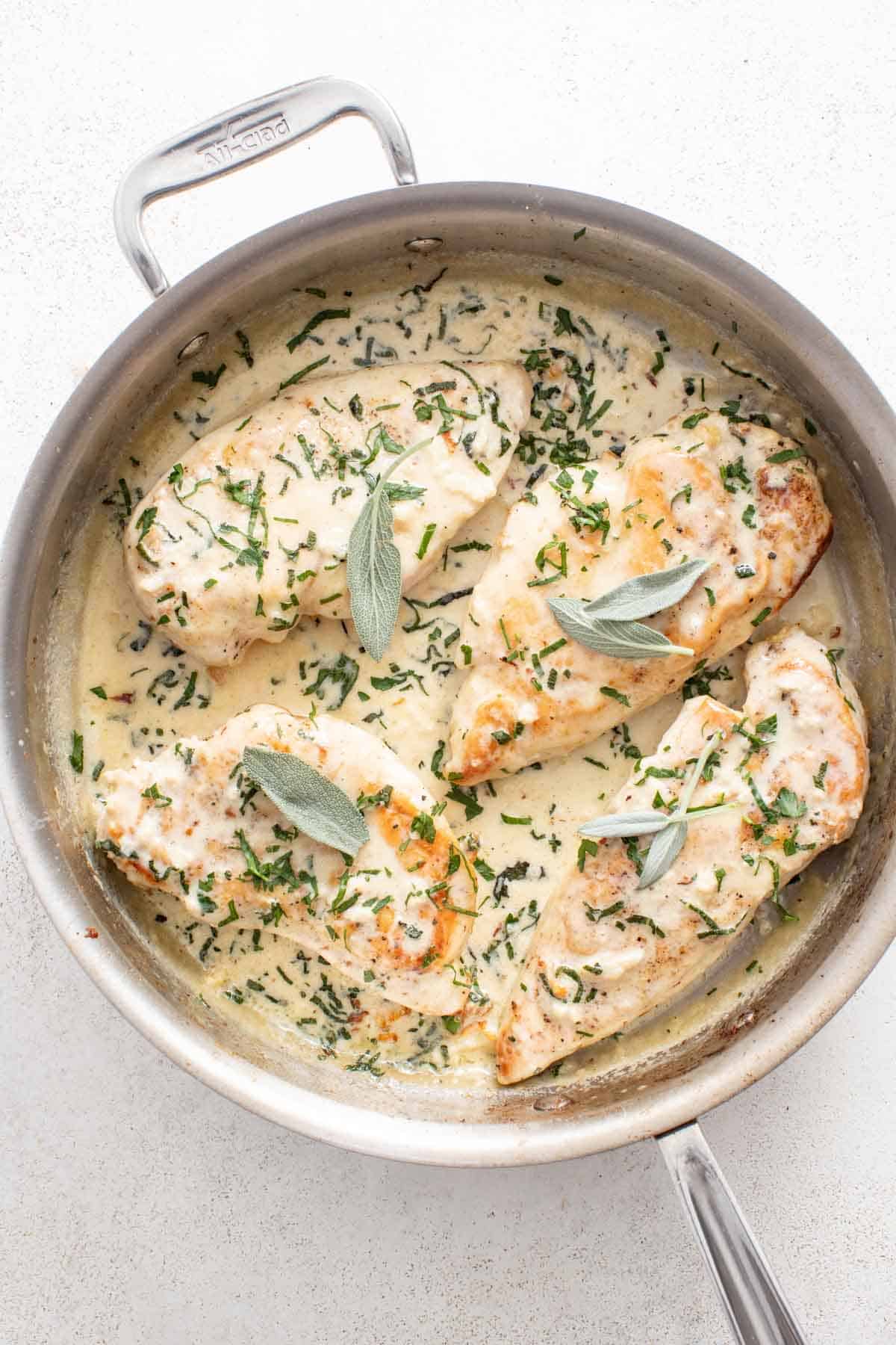 Sage chicken in an all clad stainless pan.