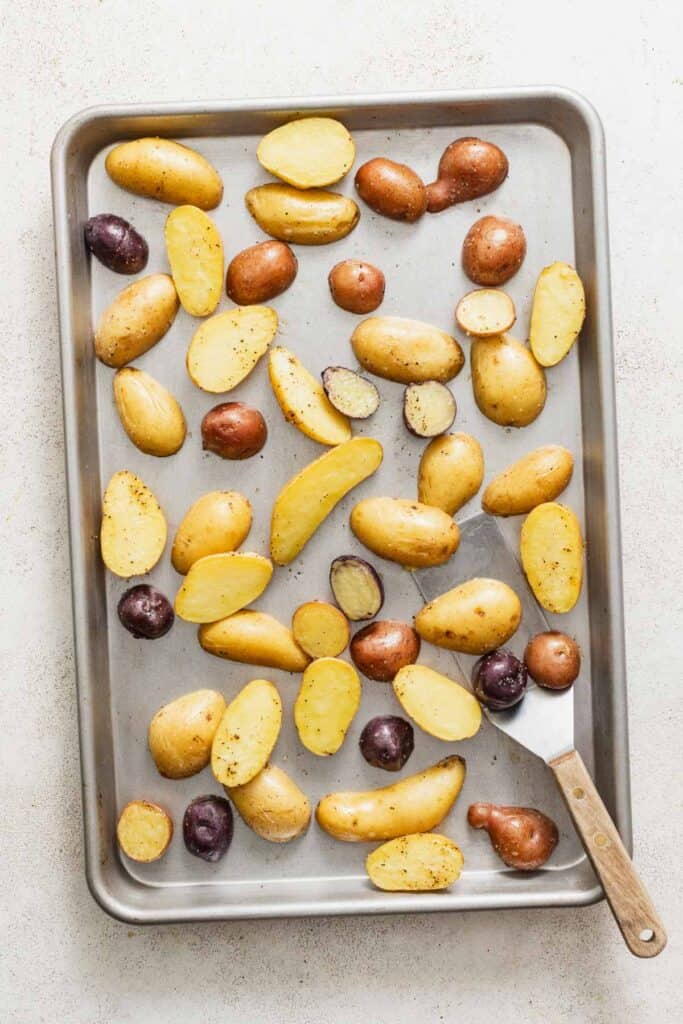 Baby potatoes on a sheet pan after roasting.
