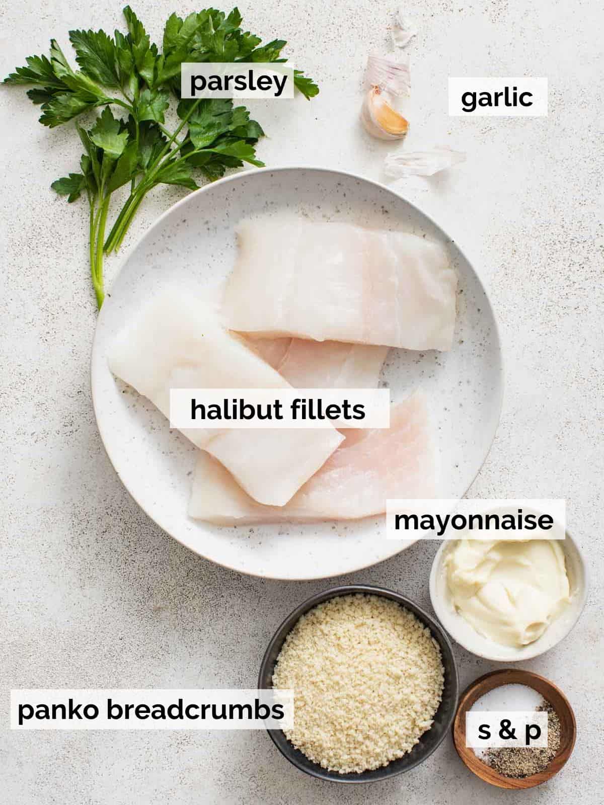 Ingredients for air fryer halibut on a white table.