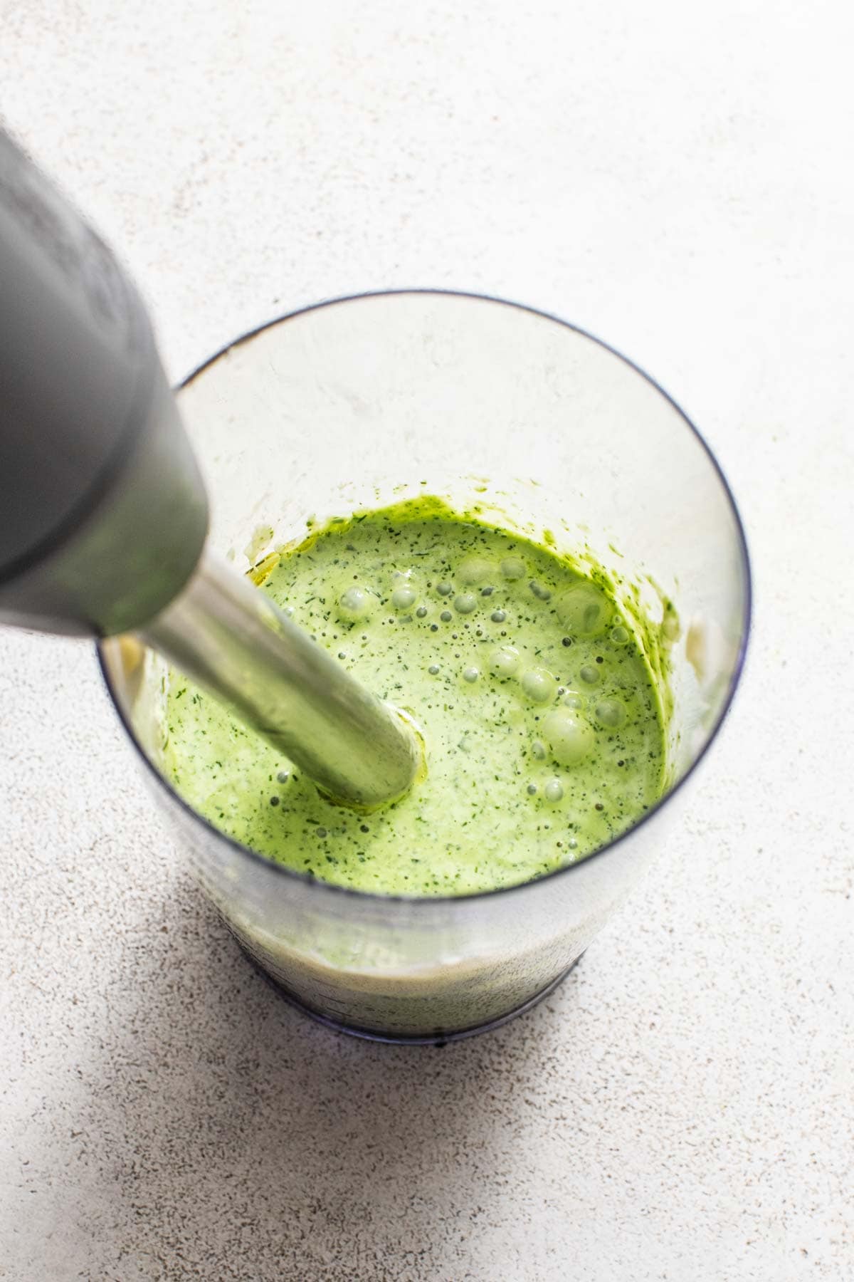 Blending the green goddess marinade for the chicken thighs.